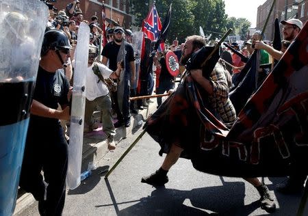 FILE PHOTO: White nationalists clash with counter protesters at a rally in Charlottesville, Virginia, U.S., August 12, 2017. REUTERS/Joshua Roberts/File Photo