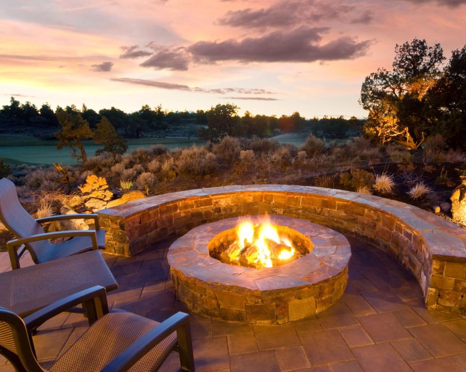 outdoor fire pit overlooking a sunset