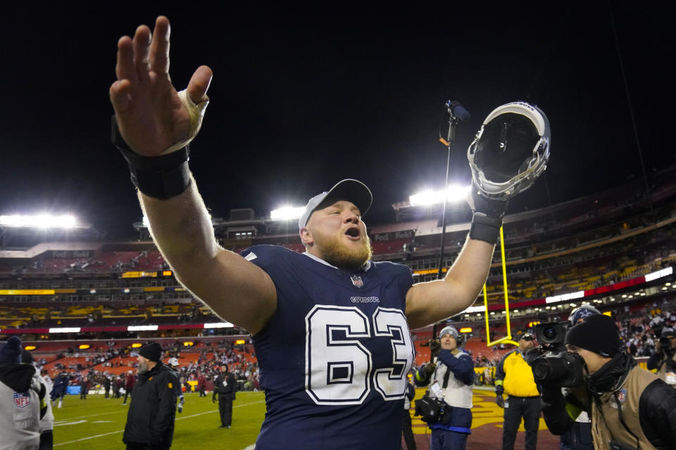 Dallas Cowboys center Tyler Biadasz (63) reacting to fans at the end of an NFL football game against the Washington Commanders, Sunday, Jan. 7, 2024, in Landover, Md. Dallas won 38-10. (AP Photo/Jessica Rapfogel)