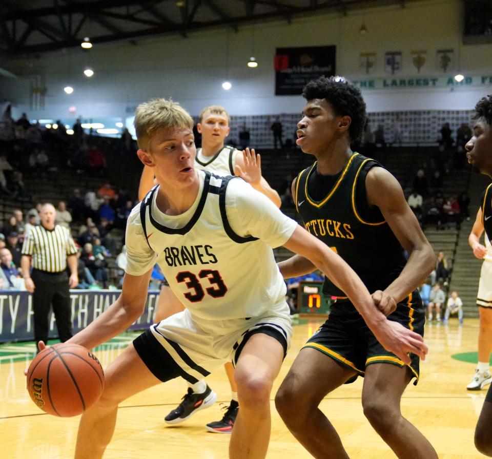 Brownstown Central forward Chace Coomer (33) dribbles the ball down low during the 2023 Indiana Hall of Fame Classic. Crispus Attucks defeats Brownstown 76-51.