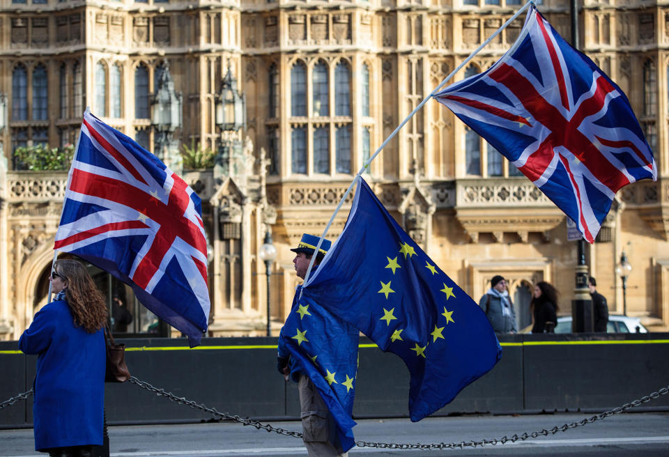 Anti-brexit protesters wave Union Jack and EU flags outside the Houses of Parliament on December 8, 2017: Getty Images