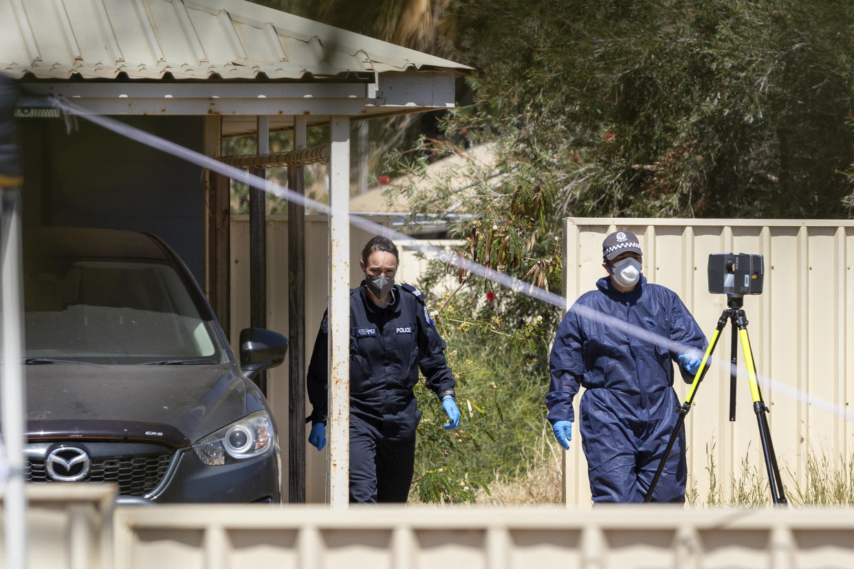 Police investigate at a house, Thursday, Nov. 4, 2021, where 4-year-old Cleo Smith was rescued in Carnarvon, Australia. Police expected to charge a local man with abducting Cleo from her family's camping tent 18 days before police smashed into a locked house and rescued her in an outcome celebrated around Australia. (Richard Wainwright/AAP Image via AP)