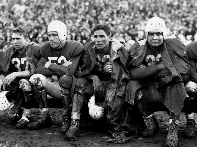 Halfback Charley Trippi of the Chicago Cardinals (without his helmet) sits on the bench during his Chicago Cardinals' 45-21 loss to Washington in 1947. (Photo: Nate Fine via Getty Images)