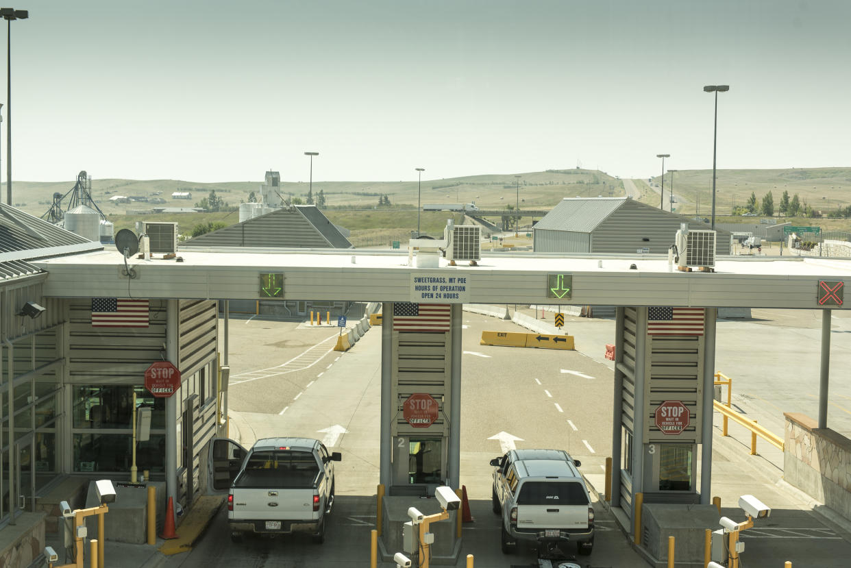 Trucks and cars entering the USA at the Customs and Border Protection Sweetgrass border crossing on Interstate 15 in Sweetgrass, Montana on August 1, 2017. 130,000 trucks and 260,000 passengers cars cross the border at Sweetgrass each year.