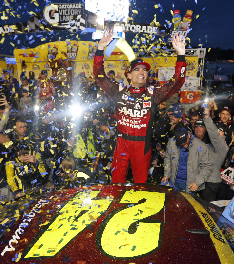 FILE - In this Nov. 1, 2015, file photo, Jeff Gordon celebrates in Victory Lane after winning the NASCAR Sprint Cup Series auto race at Martinsville Speedway in Martinsville, Va. Gordon headlines the 10th class of the NASCAR Hall of Fame for his storied career on and off the track. He'll be inducted on Friday night, Feb. 1,2019, along with NASCAR team owners Roger Penske and Jack Roush. (AP Photo/Steve Helber, File)