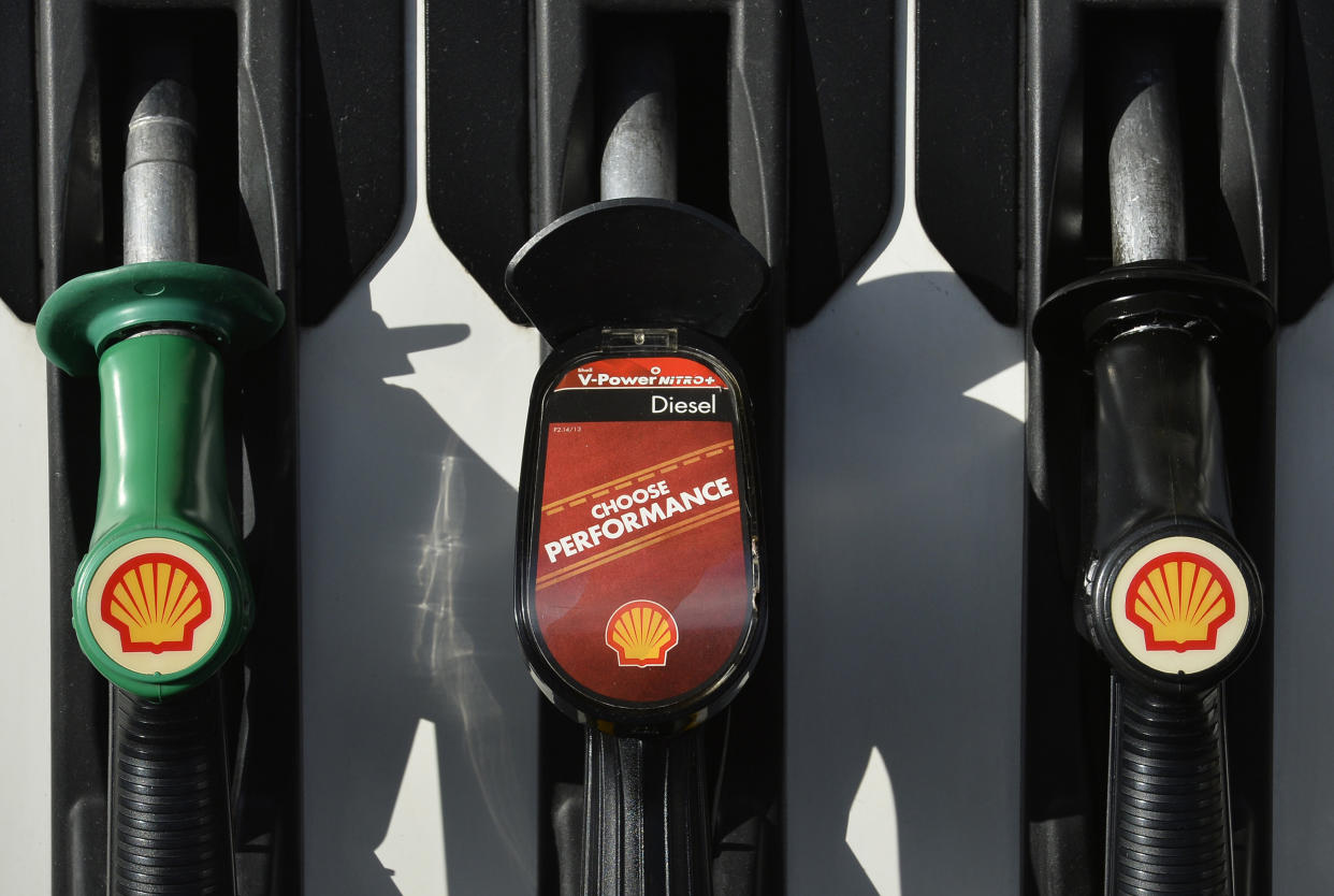 Fuel prices Shell logos are seen on fuel pumps at a petrol station in west London, January 29, 2015. Royal Dutch Shell blamed writedowns and forex losses for making almost no money in oil production, its most powerful division, in the last quarter of 2014, causing the company to miss profit forecasts by more than 20 percent. Shell, the largest of the European energy majors, also announced a relatively modest three-year, $15 billion cut in spending to help it weather the plunge in oil prices. REUTERS/Toby Melville (BRITAIN - Tags: BUSINESS ENERGY)