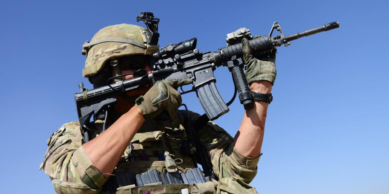 A US Army soldier attached to 2nd platoon, C troop, 1st Squadron (Airborne), 91st U.S Cavalry Regiment, 173rd Airborne Brigade Combat Team operating under the International Security Assistance Force (ISAF) looks through his rifle during a patrol near Baraki Barak base in Logar Province, on October 10, 2012.