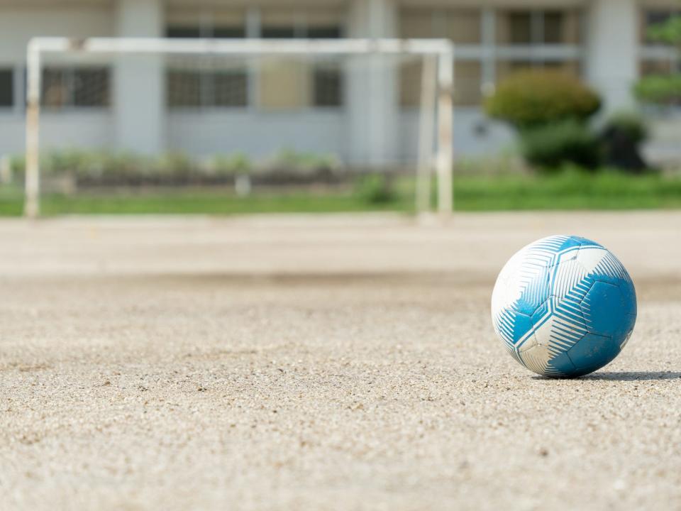 Rural elementary school soccer ball and soccer goal