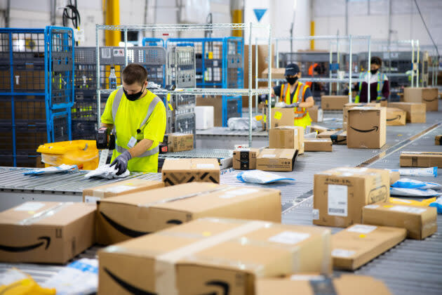 Workers in an Amazon distribution center. (Amazon Photo)
