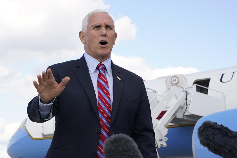 Vice President Mike Pence speaks to members of the media at Andrews Air Force Base, Md., Monday, Oct. 5, 2020, as he leaves Washington for Utah ahead of the vice presidential debate schedule for Oct. 7. (AP Photo/Jacquelyn Martin)