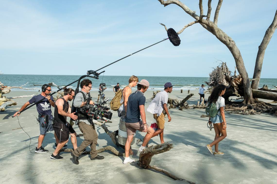 The cast and crew of Netflix’s “Outer Banks” walk along a South Carolina while filming the new series there in July 2019. Curtis Baker/Netflix