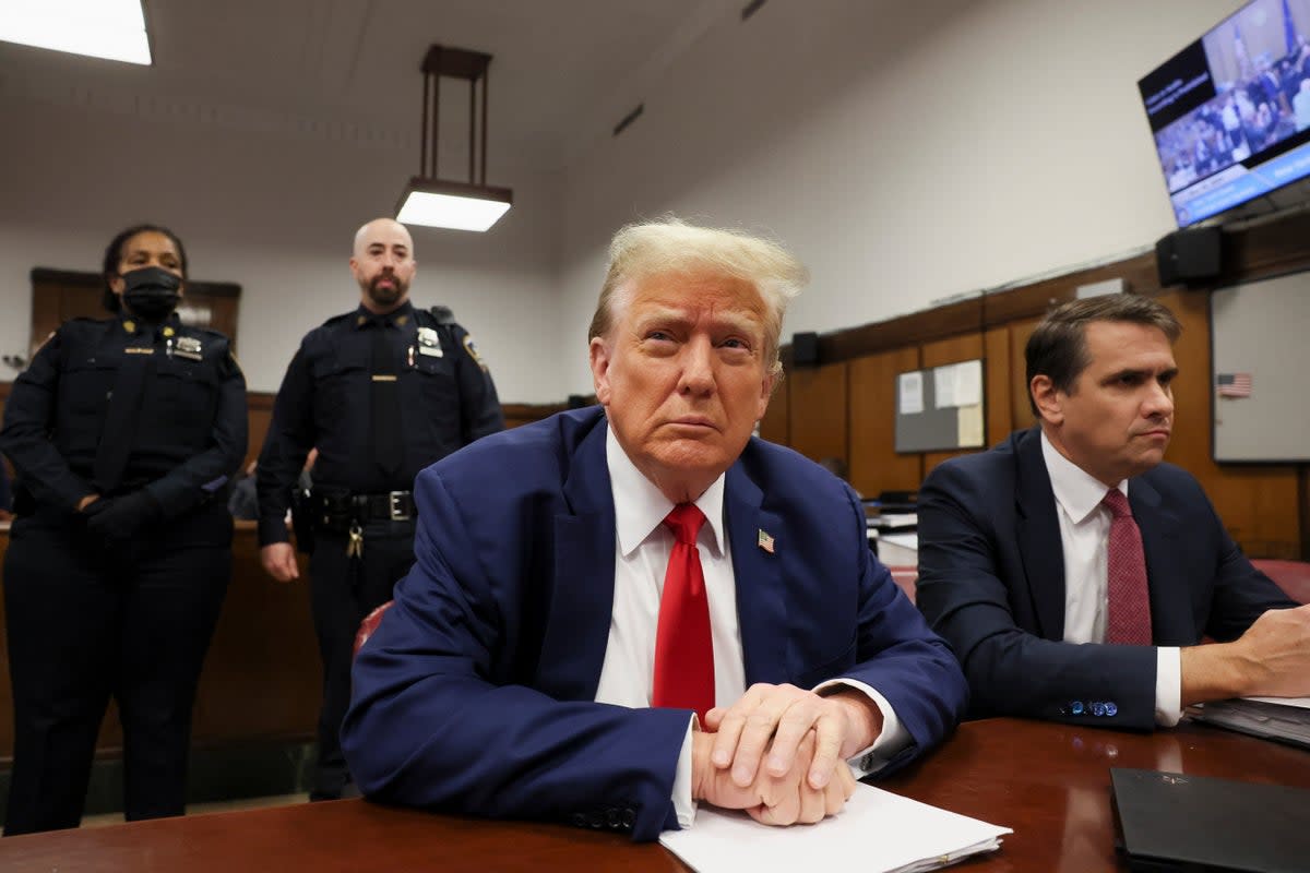 Donald Trump appears in a criminal courtroom in Manhattan on 6 May as the fourth week of his hush money trial begins (AP)