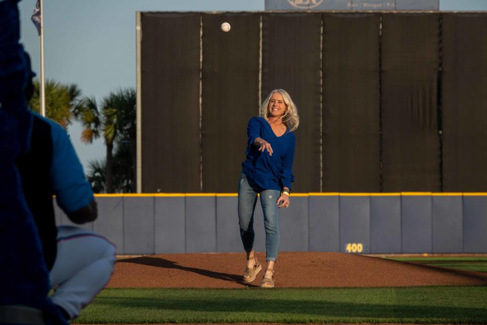 Former Pensacola star athlete Melissa Miller-Schubeck throws out a first pitch at Blue Wahoos Stadium prior to the April 21 game vs. Montgomery Biscuits.