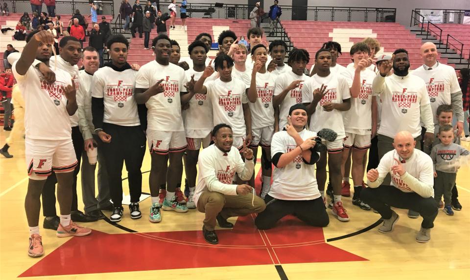 Fairfield boys basketball celebrates its third-straight Greater Miami Conference championship after defeating Hamilton at home Feb. 3, 2023.