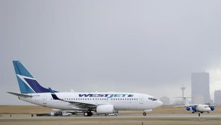 A Westjet Boeing 737-700 takes off at the International Airport in Calgary, Alberta, May 3, 2011. REUTERS/Todd Korol