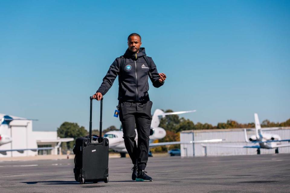 Darrius Barnes hops off a flight before Charlotte FC’s playoff match in New York in October 2023.