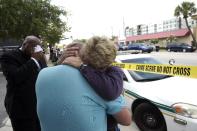 <p>Terry DeCarlo, executive director of the LGBT Center of Central Florida, center, is comforted by Orlando City Commissioner Patty Sheehan, right, after a shooting involving multiple fatalities at a nightclub in Orlando, Fla., June 12, 2016. (AP Photo/Phelan M. Ebenhack) </p>