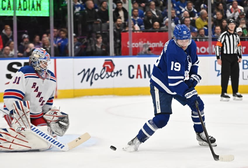 Toronto Maple Leafs forward Calle Jarnkrok (19) deflects the puck in front of New York Rangers goalie Igor Shesterkin (31) in the first period at Scotiabank Arena.