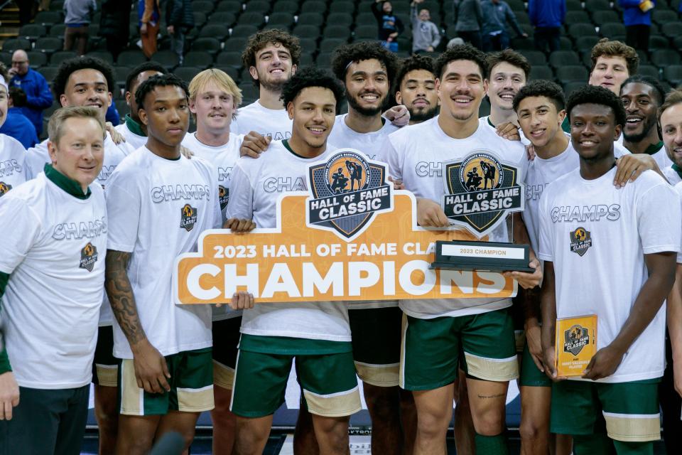 Nov 23, 2023; Kansas City, Missouri, USA; against the Colorado State Rams hold up the champions sign after the game against the Creighton Bluejays at T-Mobile Center. Mandatory Credit: William Purnell-USA TODAY Sports