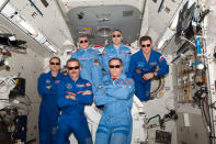 The International Space Station's Expedition 34 crew pose for a team portrait with sunglasses. The six men made time during their experiments and work aboard the ISS to watch the Super Bowl on February 3, 2013.