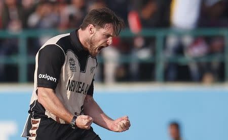 FILE PHOTO - Cricket - Australia v New Zealand - World Twenty20 cricket tournament - Dharamsala, India, 18/03/2016. New Zealand's Mitchell McClenaghan celebrates taking the wicket of Australia's Shane Watson. REUTERS/Adnan Abidi