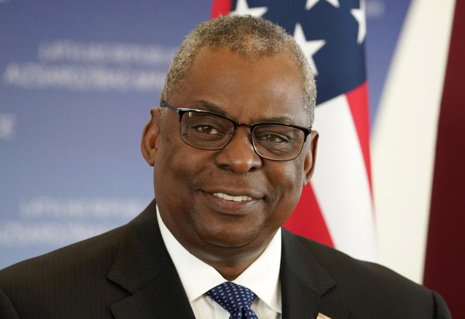 U.S. Secretary of Defense Lloyd Austin smiles during the press conference with Minister of Defence of Latvia Artis Pabriks during the press conference in Riga, Latvia, Wednesday, Aug. 10, 2022. (AP Photo/Roman Koksarov)