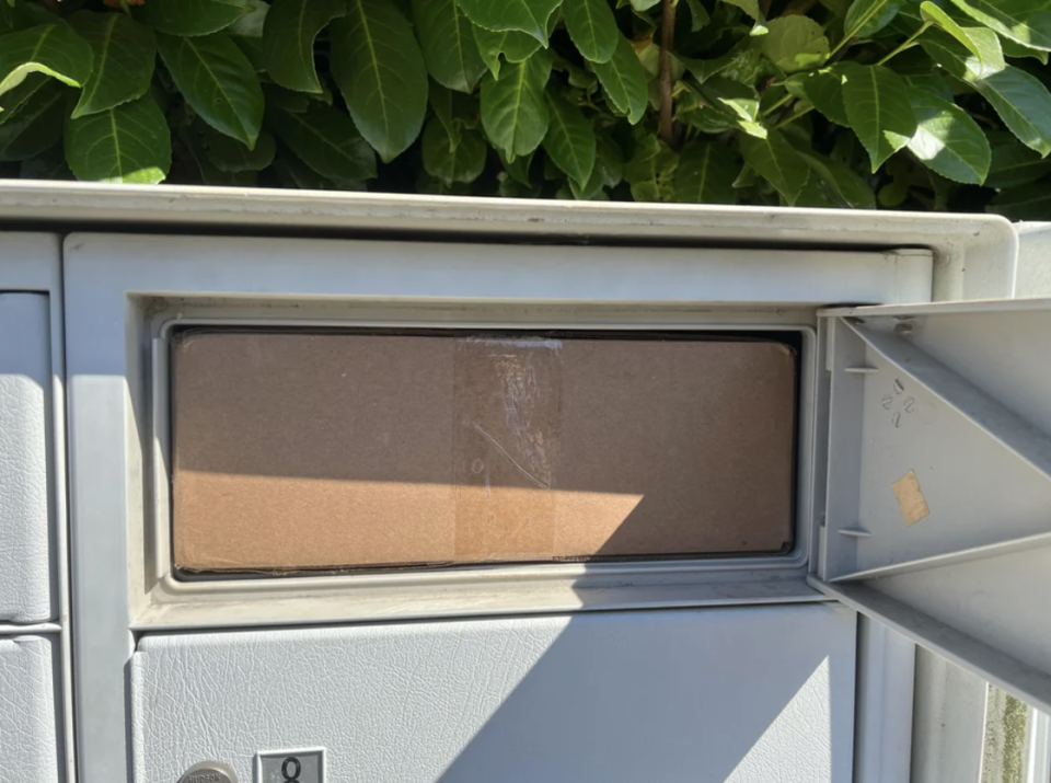 package can't get out of the mailbox because there is nothing to grab nor room to reach in and get it