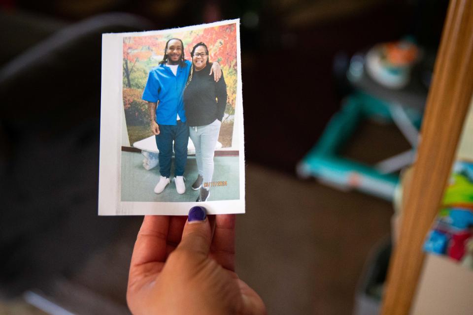 Nakia Dalton holds up a photo of her and her son, Deante Dalton, on Wednesday, June 12, 2024, at Nakia's home in Elkhart.