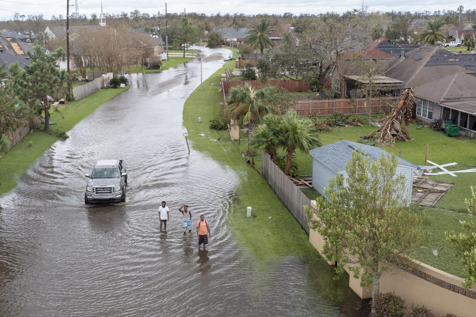 Flooded streets are shown in the Spring Meadow subdivision in LaPlace, La., after Hurricane Ida moved through Monday, Aug. 30, 2021. Hard-hit LaPlace is squeezed between the Mississippi River and Lake Pontchartrain. (AP Photo/Steve Helber)