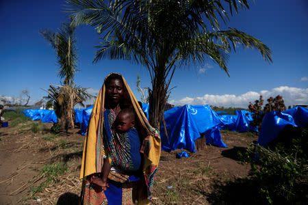 A woman stands at a camp for the people displaced in the aftermath of Cyclone Idai in John Segredo near Beira, Mozambique March 31, 2019. REUTERS/Zohra Bensemra?