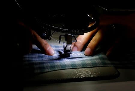 A labourer works at TAL garment factory in Vinh Phuc province, Vietnam May 23, 2017. Picture taken May 23, 2017. REUTERS/Kham