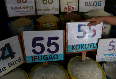 Prices of different variety of rice are seen in a public market in Kamuning in Quezon City, metro Manila, May 21, 2018. REUTERS/Dondi Tawatao