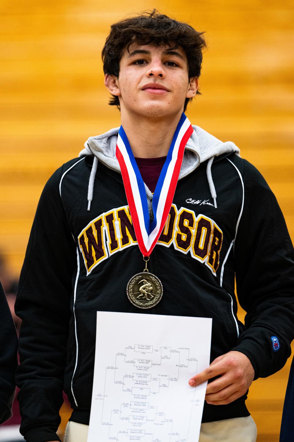 James Pantoja of Windsor High School poses on the podium after the Arnold Torgerson Memorial tournament on Jan. 6 at Fort Collins High School in Fort Collins. Pantoja took first place in the 113 lbs. weight class.