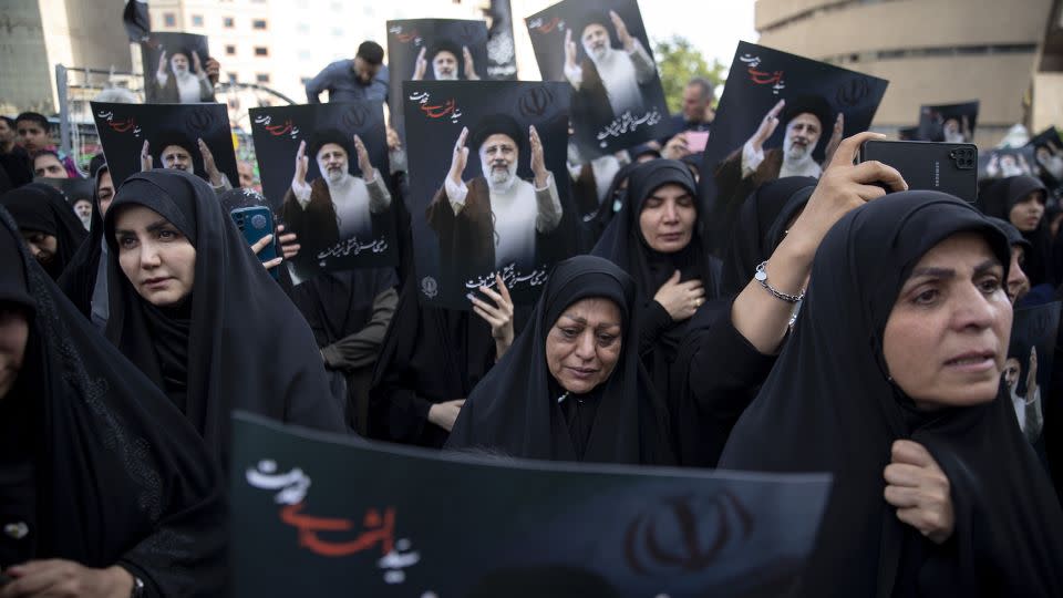 People mourn the death of President Ebrahim Raisi and Foreign Minister Hossein Amir-Abdollahian in a helicopter crash the previous day, at Valiasr Square, on May 20, 2024 in Tehran, Iran. - Majid Saeedi/Getty Images