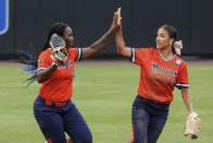 Morgan State's Anaya Hunte, left, celebrates with Mia Ewell (13) after making a catch during an NCAA college softball game against Duke, Friday, May 17, 2024, in Durham, N.C. (AP Photo/Ben McKeown)