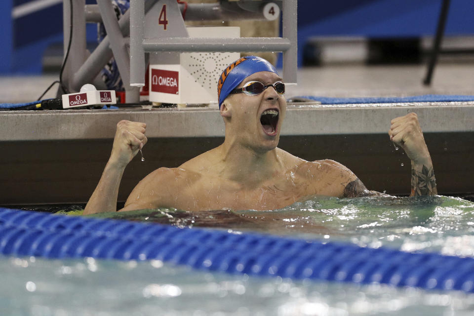 FILE - In this March 23, 2018, file photo, Florida's Caeleb Dressel celebrates after winning the 100 meter butterfly at the NCAA men's swimming and diving championships in Minneapolis. At two years to the day the Tokyo Olympics open, Katie Ledecky is swimming as fast as ever, Caeleb Dressel is being heralded as a potential Phelps, and Missy Franklin is attempting a comeback. And Ryan Lochte is newly banned again. (Anthony Souffle/Star Tribune via AP, File)