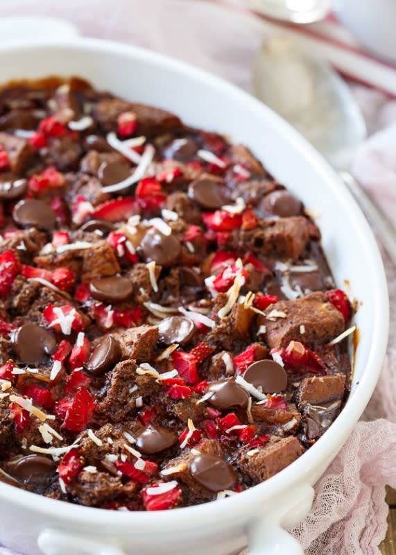 <p>This gluten-free chocolate strawberry bread pudding can be a decadent breakfast (perfect for Valentine’s Day!) or a deliciously chocolaty dessert, your pick! </p><p>Get the recipe: <a href="https://www.runningtothekitchen.com/gluten-free-chocolate-strawberry-bread-pudding/" rel="nofollow noopener" target="_blank" data-ylk="slk:Gluten-Free Chocolate Strawberry Bread Pudding;elm:context_link;itc:0;sec:content-canvas" class="link rapid-noclick-resp"><strong>Gluten-Free Chocolate Strawberry Bread Pudding</strong></a></p>