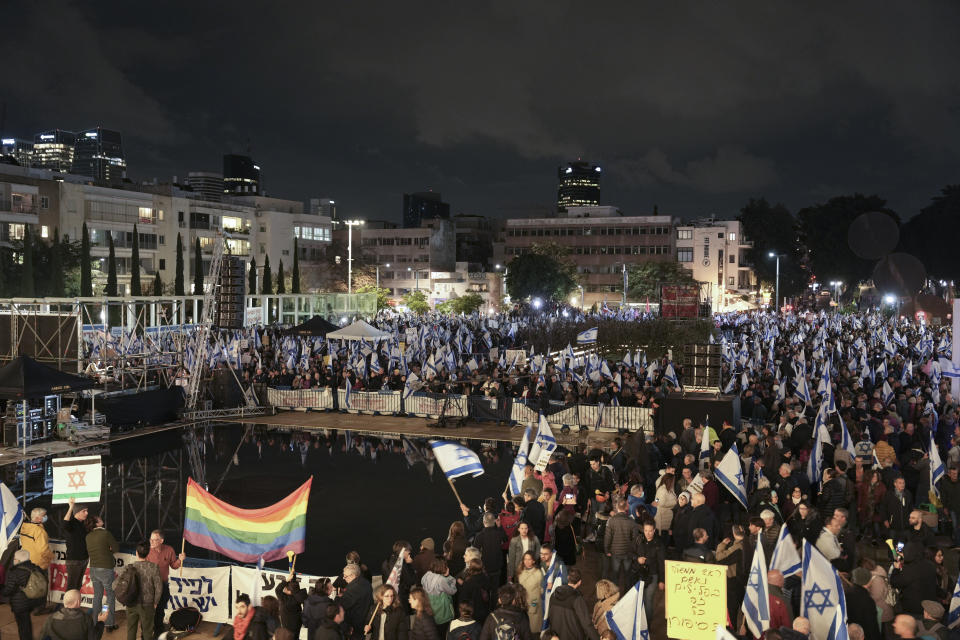 Israelis protest against the government's plans to overhaul the country's legal system, in Tel Aviv, Israel, Saturday, Jan. 14, 2023. The new government unveiled its plan this month proposing changes that critics say will weaken the country's judiciary and imperil its democratic system of checks and balances. (AP Photo/Oded Balilty)