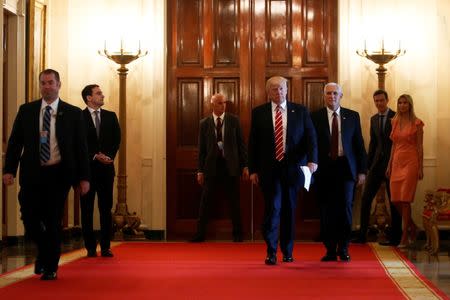 U.S. President Donald Trump and Vice President Mike Pence arrive for an event highlighting emerging technologies, in the East Room at the White House in Washington, U.S., June 22, 2017. REUTERS/Jonathan Ernst