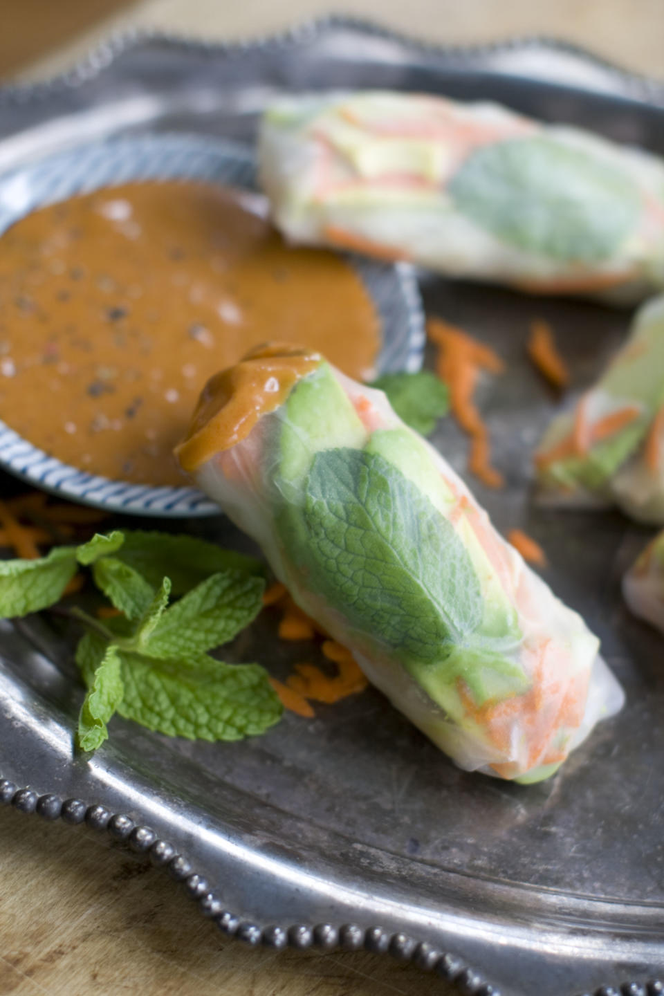 This Dec. 2, 2013 photo shows chicken and jicama spring rolls with peanut sauce in Concord, N.H. (AP Photo/Matthew Mead)