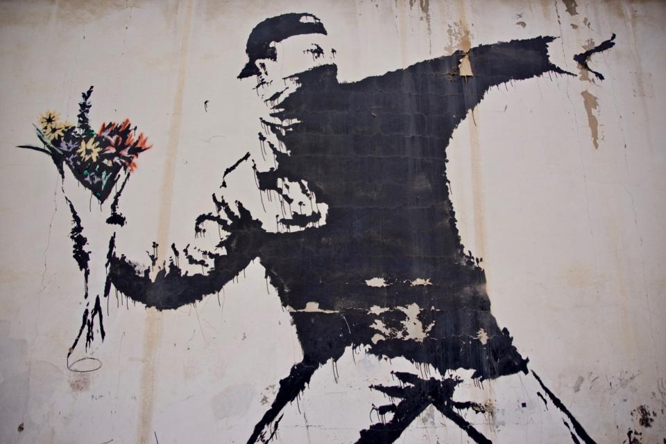 Last year the anonymous artist lost right to Flower Thrower, also known as Flower Bomber - Banksy