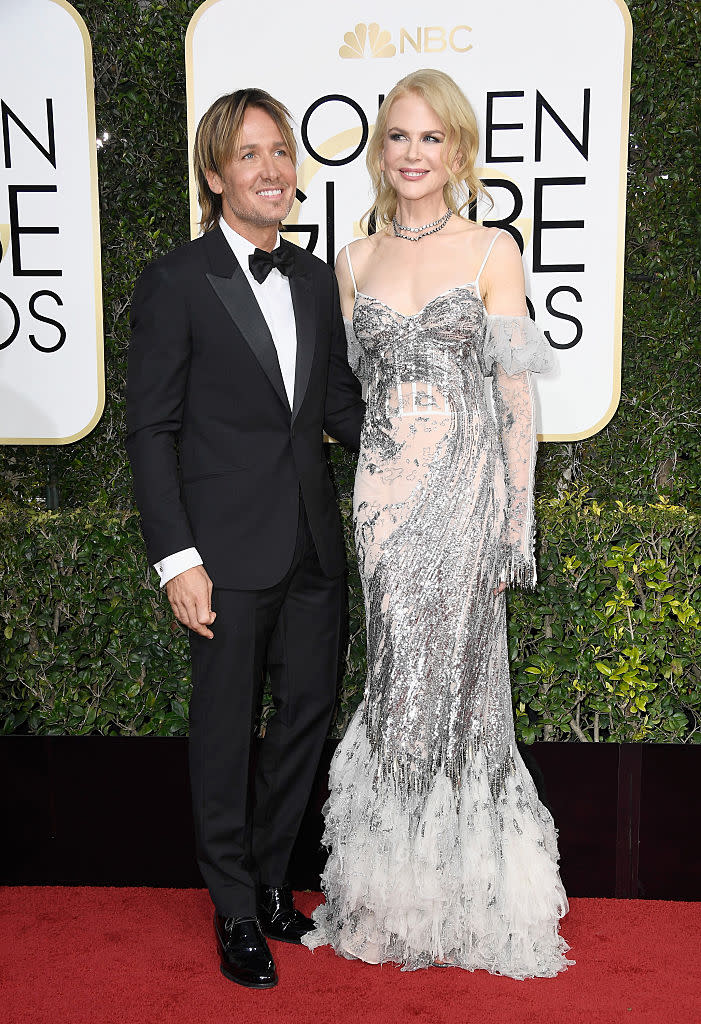 <p>Keith and Nicole have been together for 10 years and appear to be more in love than ever! Nicole shined in an off-the-shoulder Alexander McQueen gown while Keith opted for a traditional tux. </p>