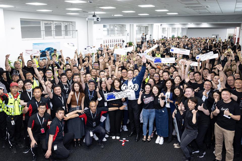 Elon Musk posed for a photo with workers at Tesla's Shanghai factory.