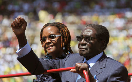 FILE PHOTO - Zimbabwe President Robert Mugabe and his wife Grace arrive for his inauguration as President, in Harare August 22, 2013. REUTERS/Philimon Bulawayo/File Photo