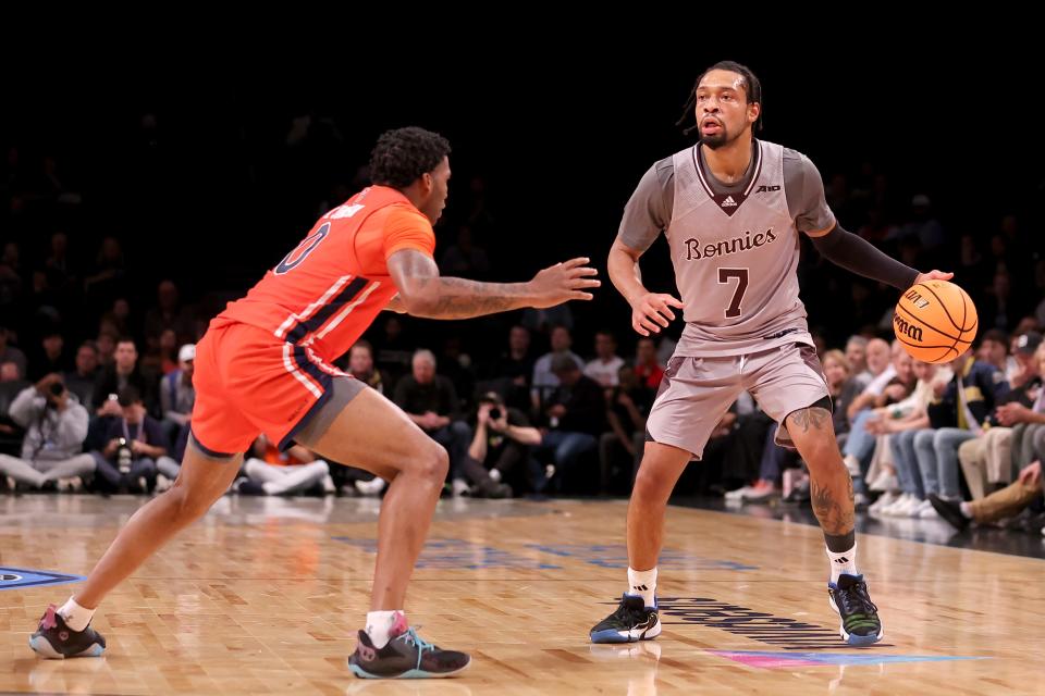 St. Bonaventure guard Charles Pride, right, shown in a November game against Auburn, scored a game-high 25 points against URI on Wednesday.