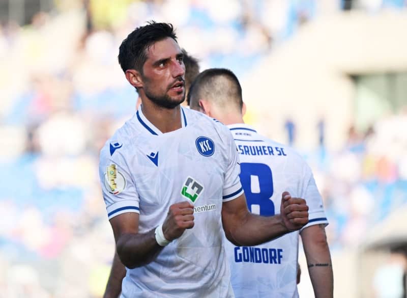 Karlsruhe's Lars Stindl celebrates his goal during the German DFB cup soccer match between FC Saarbruecken and Karlsruher SC at Ludwigspark-Stadion. Stindl will end his career after the season which he played in a return to boyhood club Karlsruhe. Uli Deck/dpa