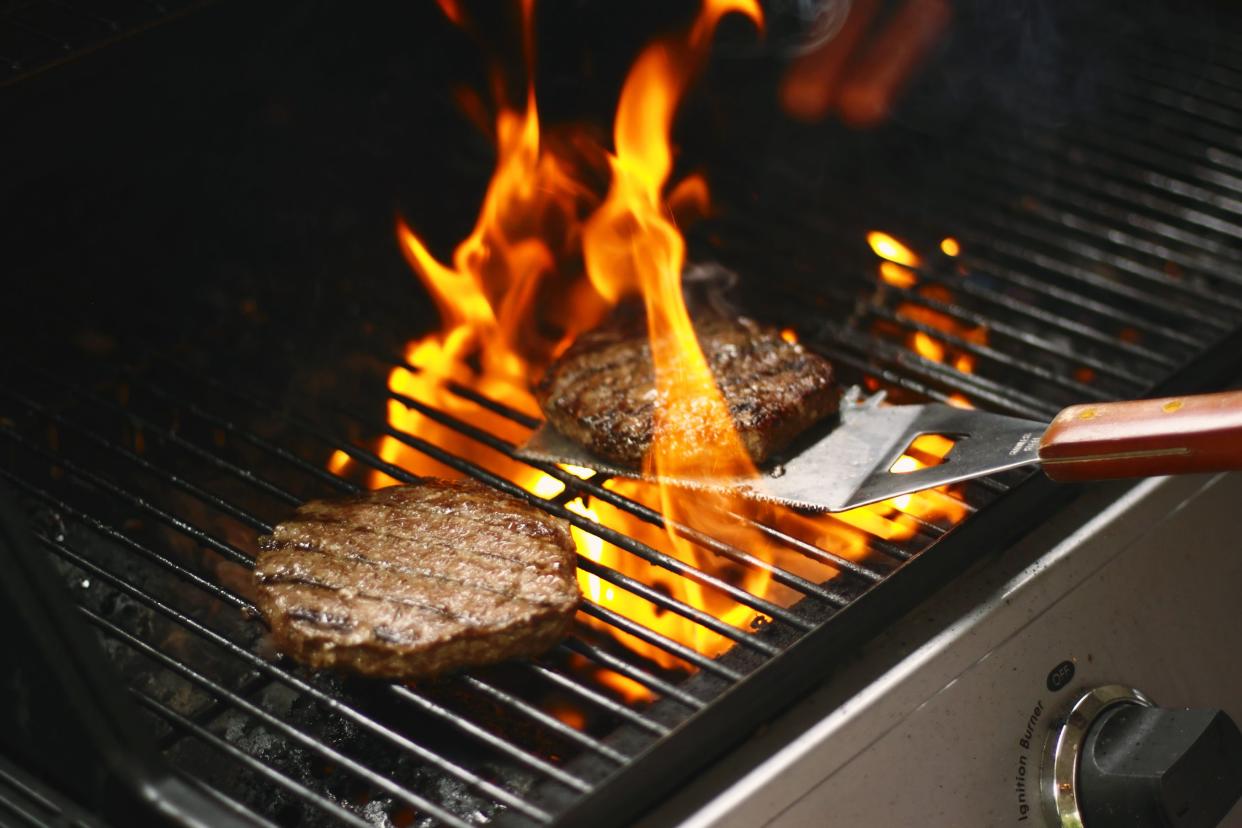 Hamburger patties grilling on the barbecue.