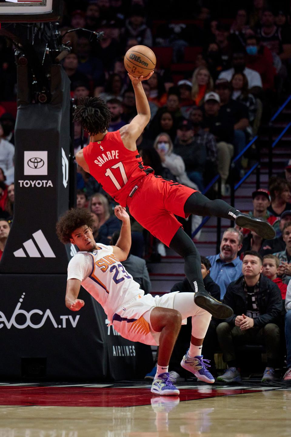 Oct 21, 2022; Portland, Oregon, USA; Portland Trail Blazers guard Shaedon Sharpe (17) is called for an offensive foul during the first half against Phoenix Suns forward Cameron Johnson (23) at Moda Center. Mandatory Credit: Troy Wayrynen-USA TODAY Sports