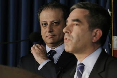 Preet Bharara (L), U.S. Attorney for the Southern District of New York, looks on as Andrew Ceresney, Director of SEC Enforcement division, speaks during a news conference in New York City, U.S. May 19, 2016. REUTERS/Brendan McDermid