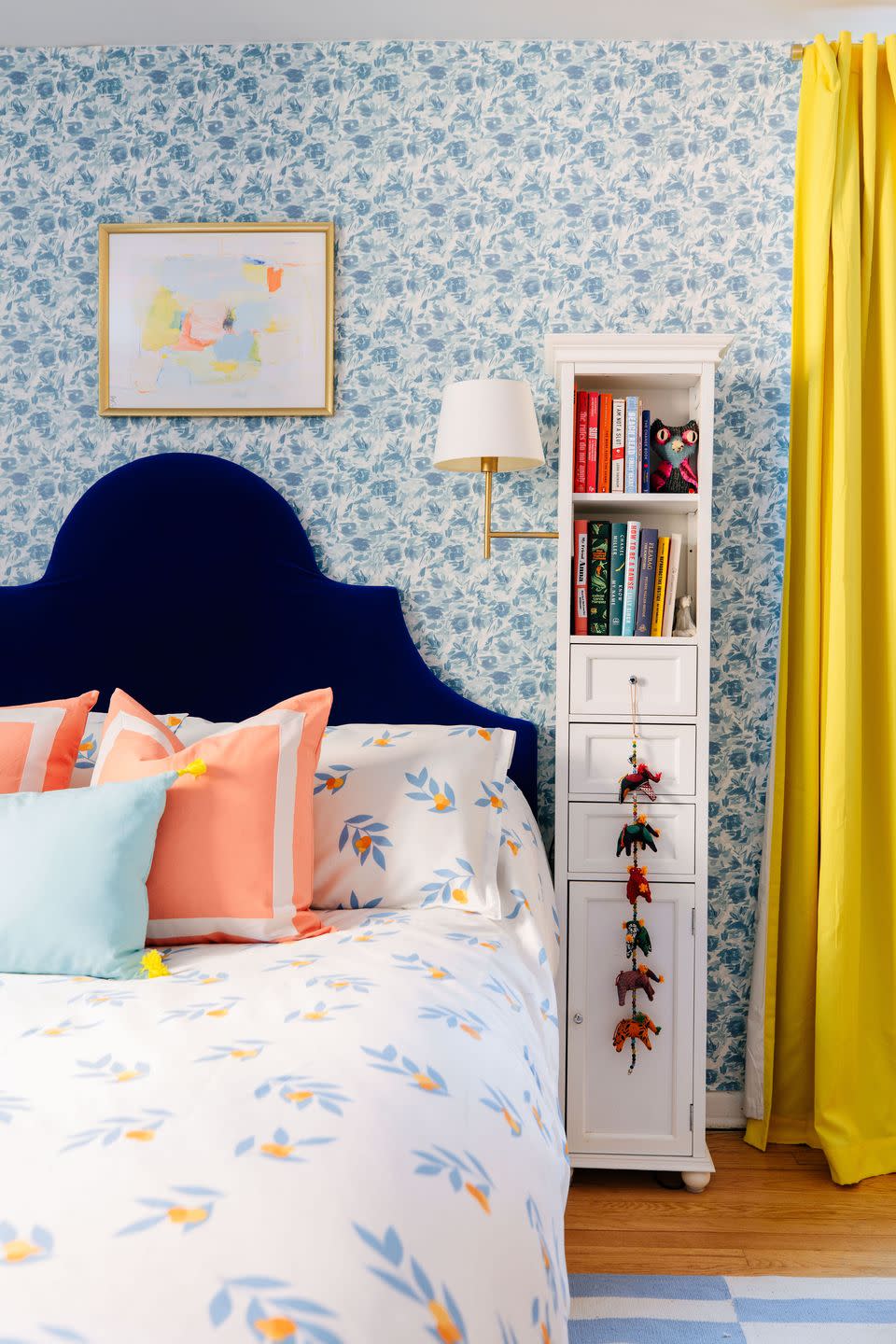 a bedroom with a bed and a bookcase